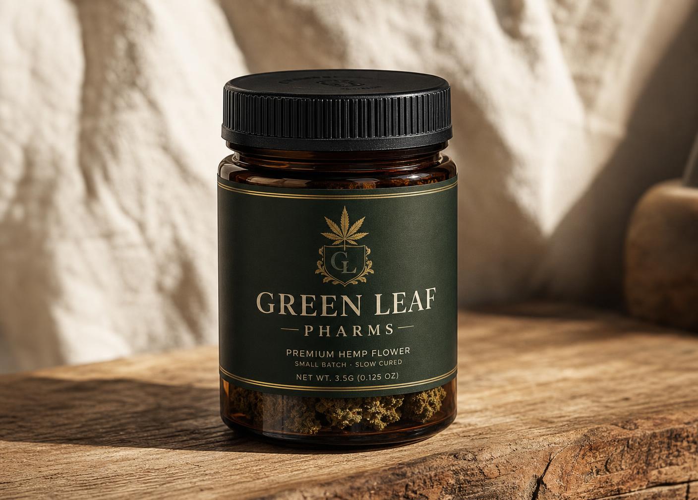 Green Leaf Pharms amber glass jar with black twist lid on rustic wood